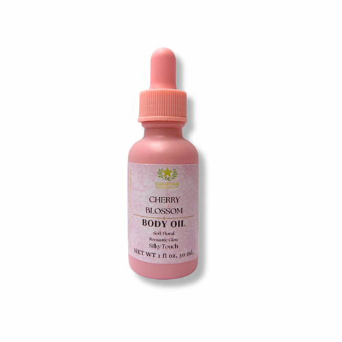 Pink bottle of Cherry Blossom body oil on a white background